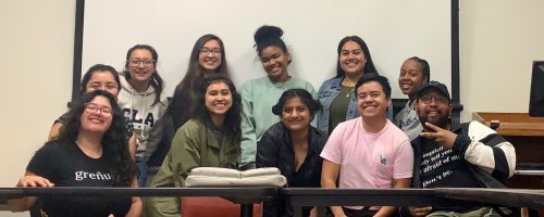 An image of the previous 2019 - 2020 Educators for Tomorrow Cohort smiling indoors.