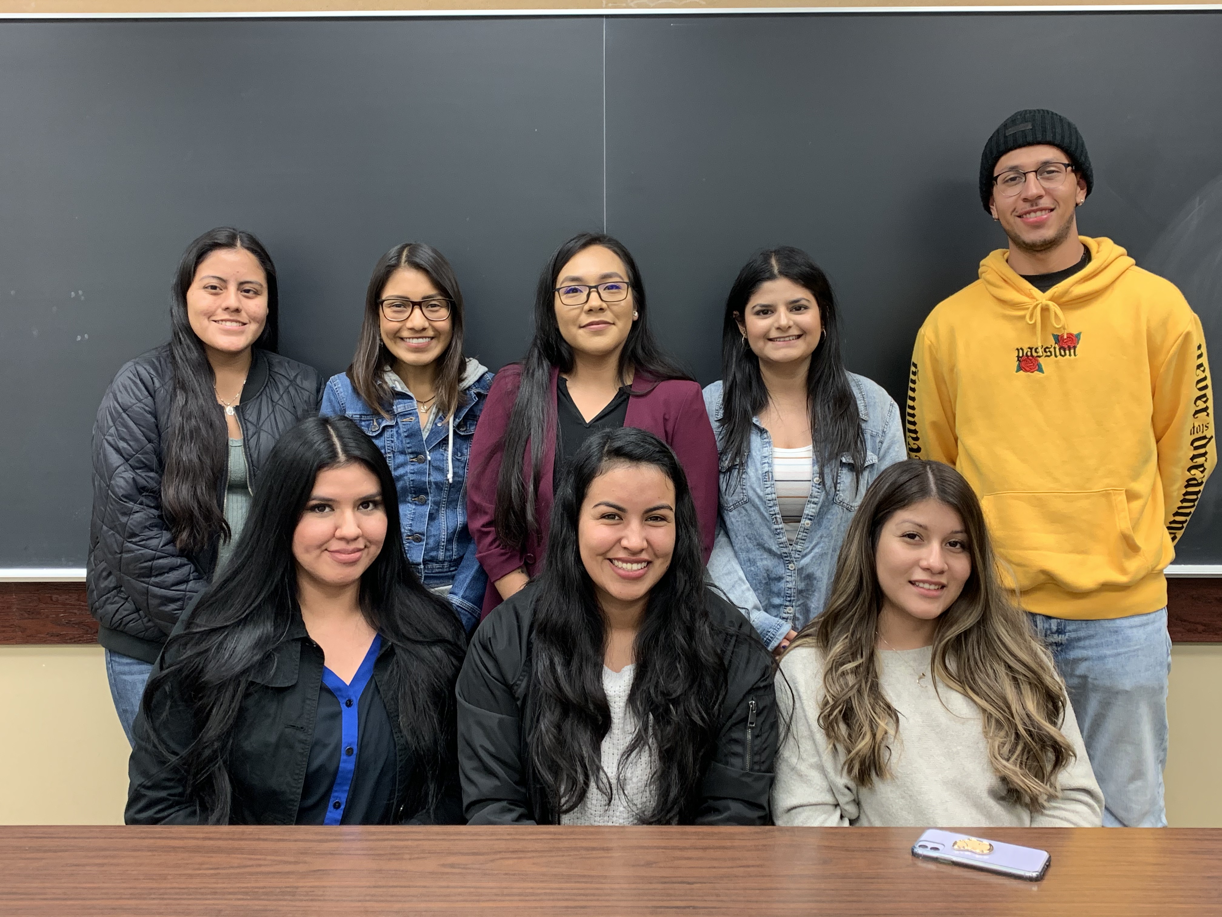 An image of the previous 2019-2020 UndocuBruins Research Program Cohort smiling indoors.