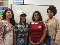 Click to show details - 10s - 10 students in front of whiteboard