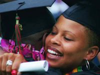 Click to show details - 90s - 7 two students hug at commencement