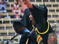 Click to show details - 90s - 8 student cheering at commencement